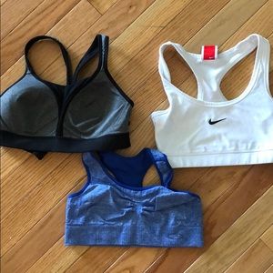 Set of 3 XS sports bras: 2 Target brand, 1 Nike.